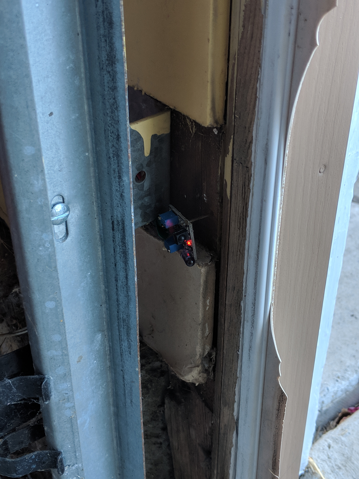 The relay is triggered by the Raspberry Pi, which opens and closes the door (left). A proximity sensor allows for the garage door service to know whether or not the door is currently open (right).